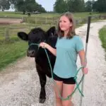 Grey Mixon with her steer Sir Loin at the Henry County Youth Livestock Show in Paris, TN
